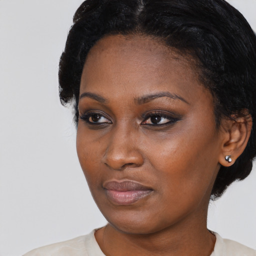 Neutral black young-adult female with short  black hair and brown eyes