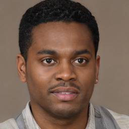 Joyful latino young-adult male with short  brown hair and brown eyes