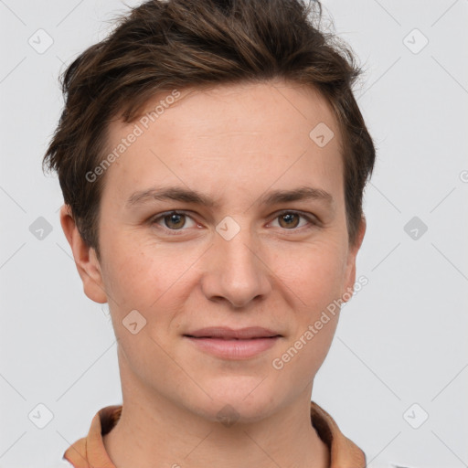 Joyful white young-adult female with short  brown hair and grey eyes