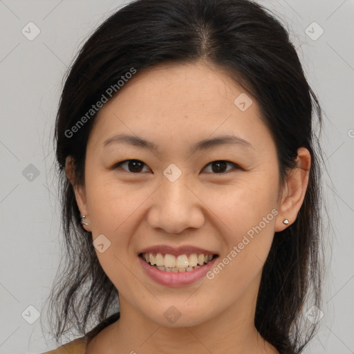 Joyful asian young-adult female with medium  brown hair and brown eyes