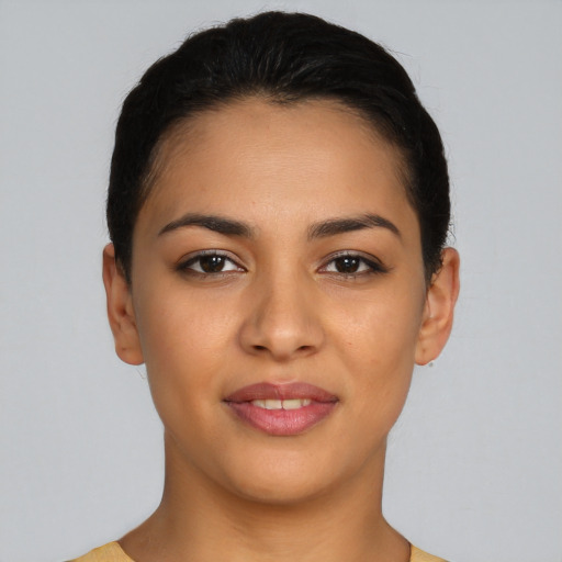 Joyful latino young-adult female with short  brown hair and brown eyes