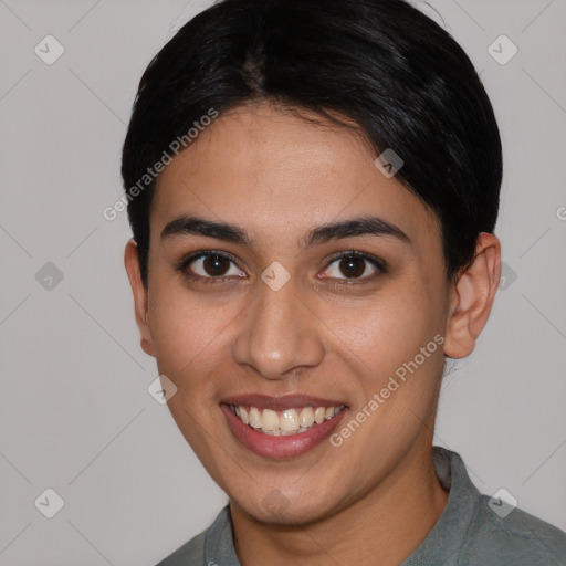 Joyful latino young-adult female with short  black hair and brown eyes