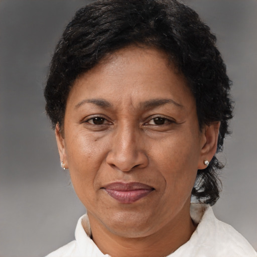 Joyful latino adult female with short  brown hair and brown eyes