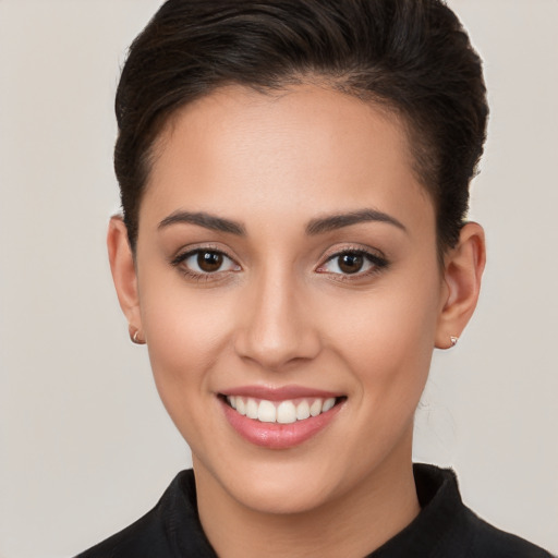 Joyful white young-adult female with short  brown hair and brown eyes