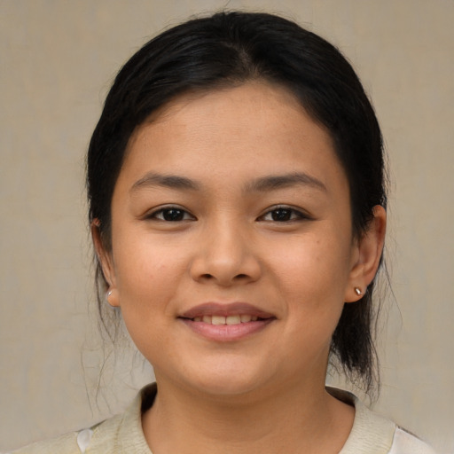 Joyful asian young-adult female with medium  black hair and brown eyes