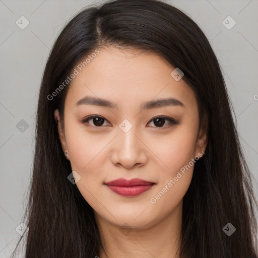 Joyful asian young-adult female with long  brown hair and brown eyes