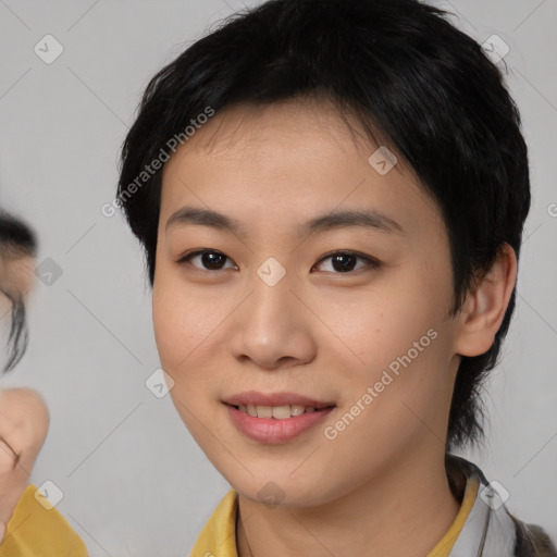 Joyful asian young-adult female with medium  brown hair and brown eyes