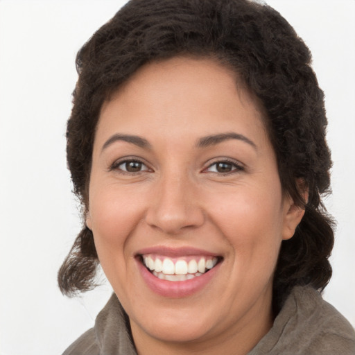 Joyful white adult female with long  brown hair and brown eyes