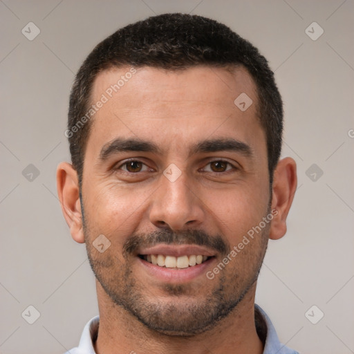 Joyful white young-adult male with short  brown hair and brown eyes