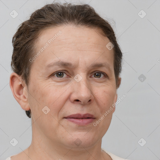 Joyful white adult female with short  brown hair and grey eyes