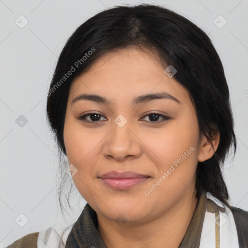 Joyful latino young-adult female with medium  black hair and brown eyes