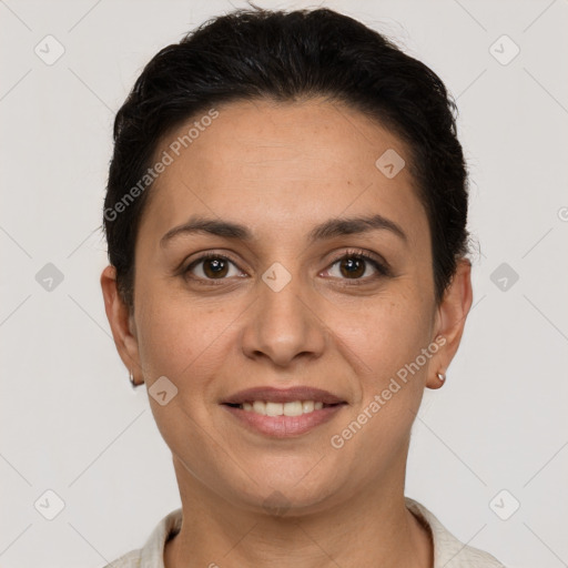 Joyful white adult female with short  brown hair and brown eyes