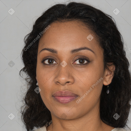 Joyful black young-adult female with long  brown hair and brown eyes