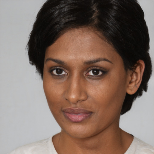 Neutral black young-adult female with short  brown hair and brown eyes