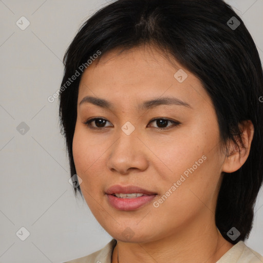 Joyful asian young-adult female with medium  brown hair and brown eyes