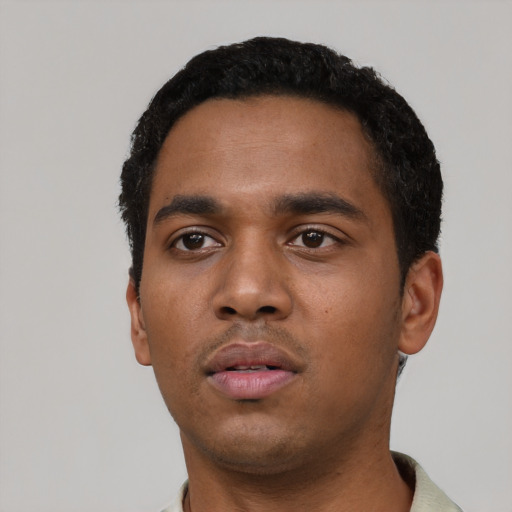 Neutral black young-adult male with short  black hair and brown eyes