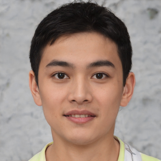 Joyful asian young-adult male with short  brown hair and brown eyes