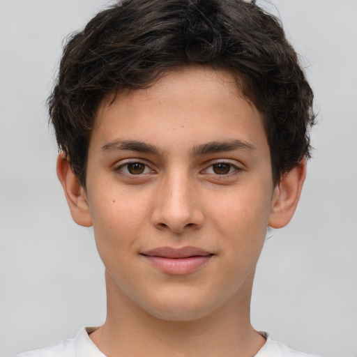 Joyful white child male with short  brown hair and brown eyes