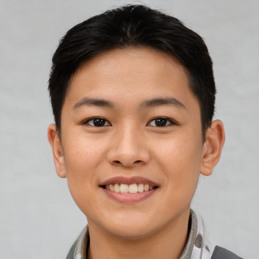 Joyful asian young-adult female with short  brown hair and brown eyes