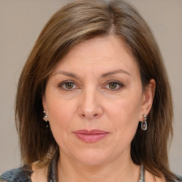 Joyful white adult female with medium  brown hair and grey eyes