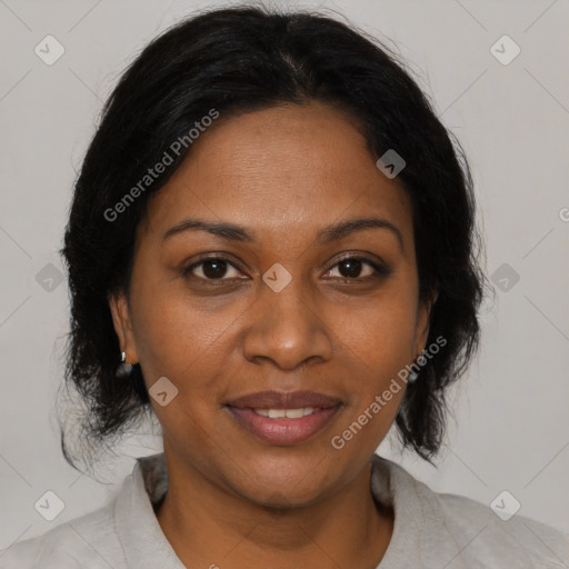 Joyful black young-adult female with medium  brown hair and brown eyes