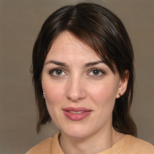 Joyful white young-adult female with medium  brown hair and brown eyes