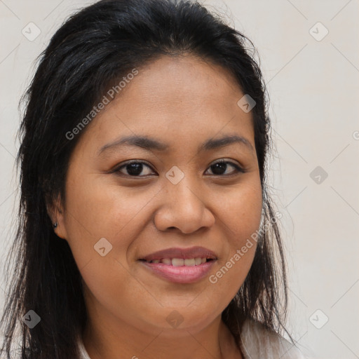 Joyful latino young-adult female with long  brown hair and brown eyes