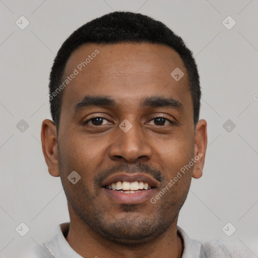 Joyful black young-adult male with short  black hair and brown eyes