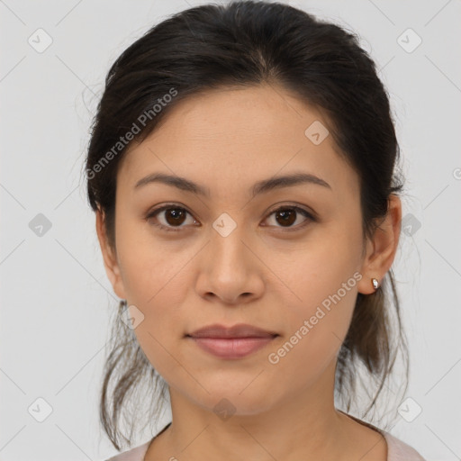 Joyful latino young-adult female with medium  brown hair and brown eyes