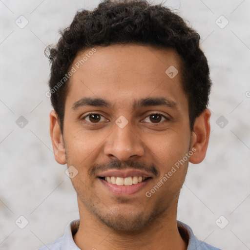 Joyful latino young-adult male with short  brown hair and brown eyes