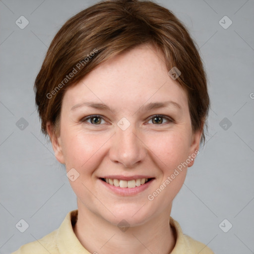 Joyful white young-adult female with short  brown hair and grey eyes