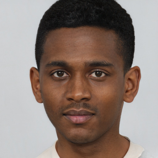 Neutral black young-adult male with short  brown hair and brown eyes