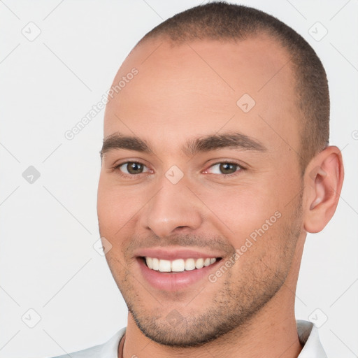 Joyful white young-adult male with short  brown hair and brown eyes