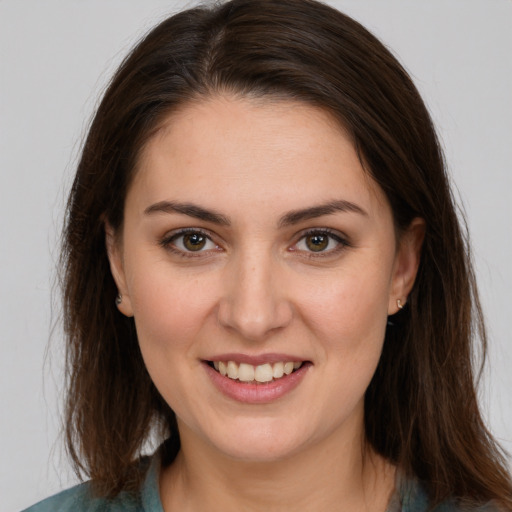 Joyful white young-adult female with medium  brown hair and brown eyes