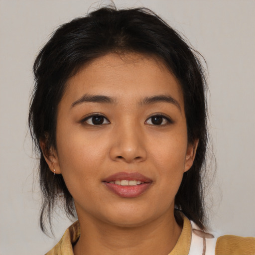 Joyful asian young-adult female with medium  brown hair and brown eyes