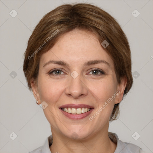 Joyful white adult female with medium  brown hair and grey eyes