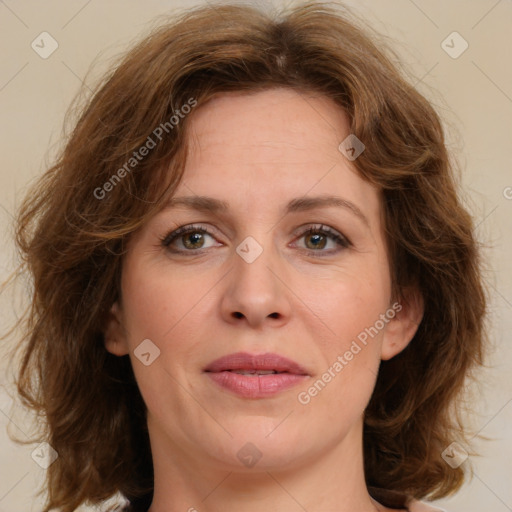 Joyful white adult female with medium  brown hair and green eyes