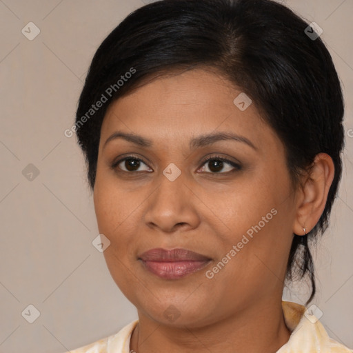 Joyful latino young-adult female with medium  brown hair and brown eyes