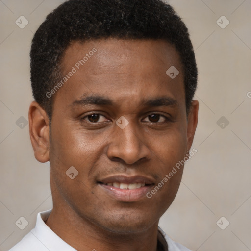 Joyful latino young-adult male with short  brown hair and brown eyes