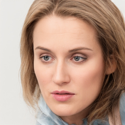 Neutral white young-adult female with medium  brown hair and blue eyes