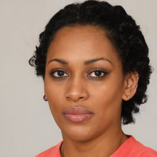 Neutral black young-adult female with short  black hair and brown eyes