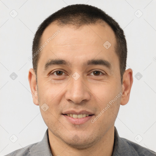 Joyful white young-adult male with short  brown hair and brown eyes