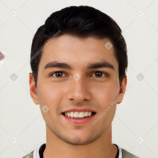 Joyful white young-adult male with short  black hair and brown eyes