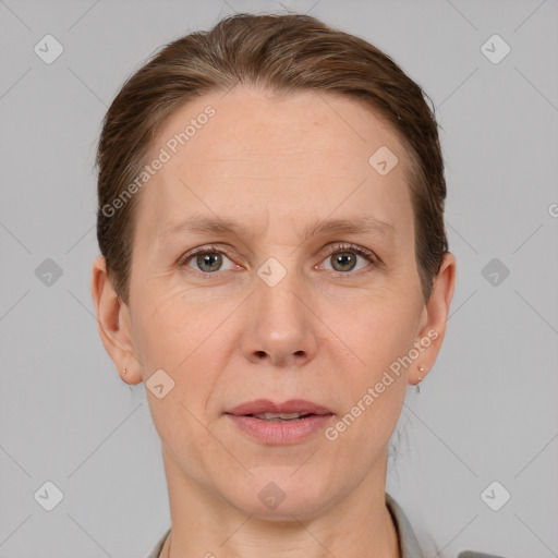 Joyful white adult female with short  brown hair and grey eyes