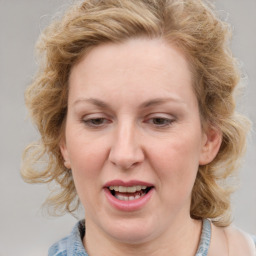 Joyful white young-adult female with medium  brown hair and blue eyes