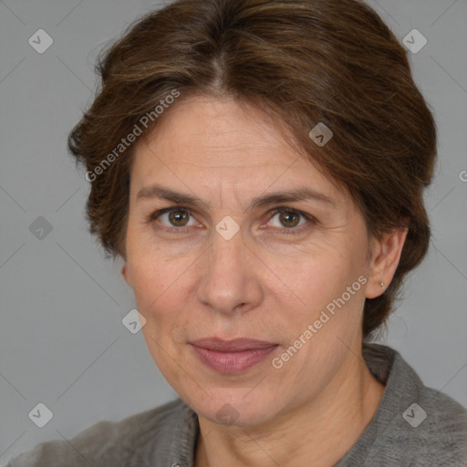 Joyful white adult female with medium  brown hair and brown eyes