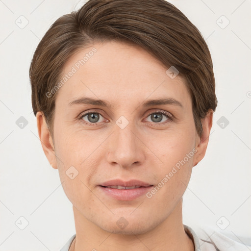 Joyful white young-adult female with short  brown hair and grey eyes