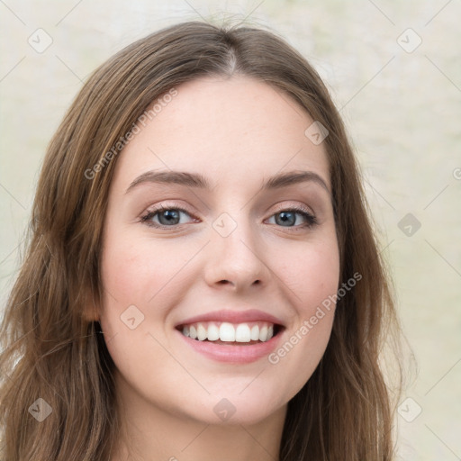 Joyful white young-adult female with long  brown hair and green eyes