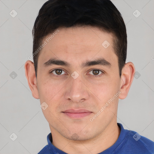 Joyful white young-adult male with short  black hair and brown eyes