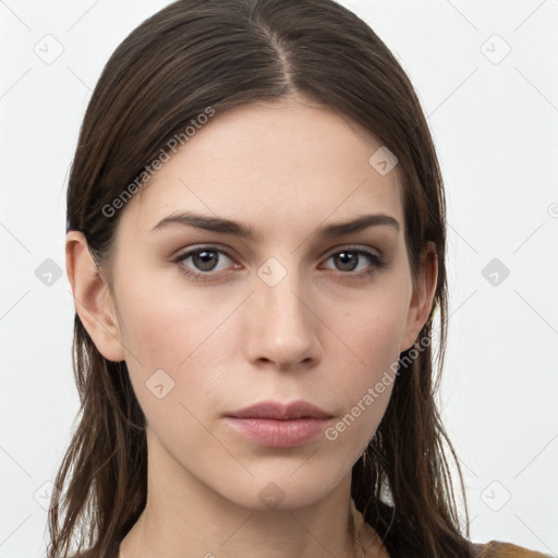 Neutral white young-adult female with long  brown hair and brown eyes